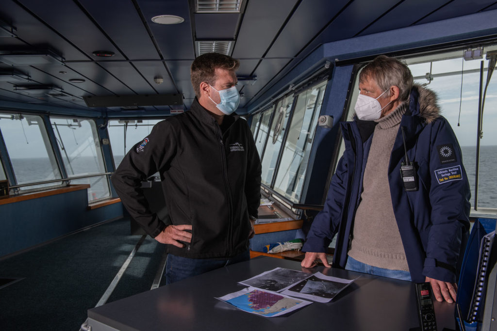 Simon Frederick Ligthelm, ice pilot (right) and Mensun Bound, director of exploration (left) of Endurance22 expedition discuss the weather and ice conditions
