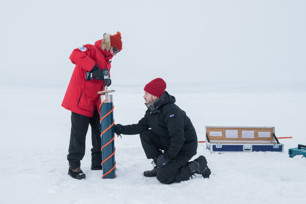 Jukka Tuhkuri (left) Aalto University and James-John Matthee (right) from Stellenbosch University take ice cores in the ice floe next to S.A. Agulhas II for further analysis in the lab.