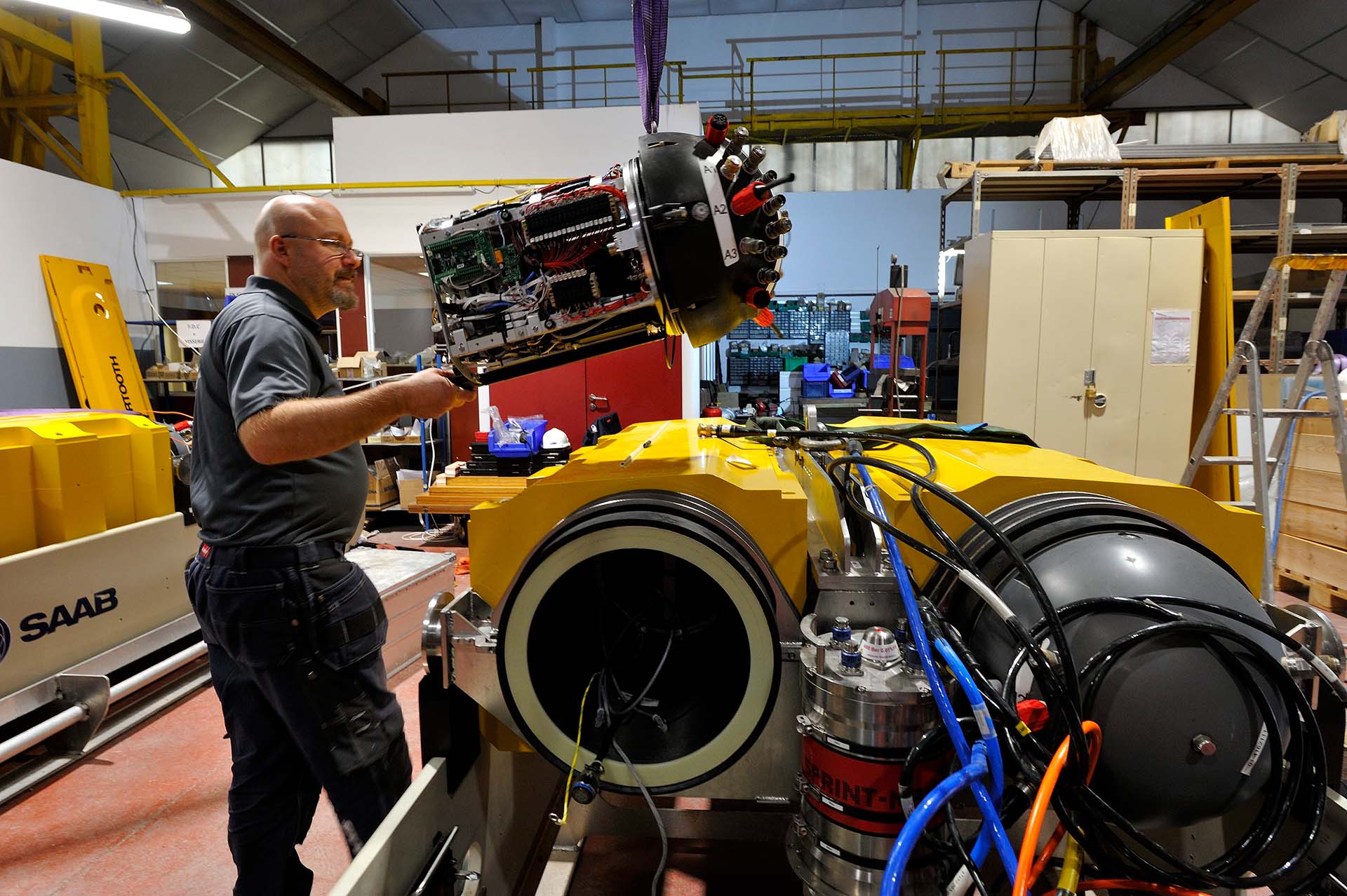 An engineer works on the SAAB Sabertooth AUV for Endurance22 cold water trials in Nov 2021.